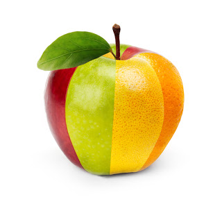 an apple made up of slices from apples oranges and pear